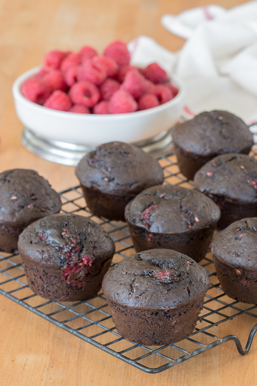 Cocoa powder imparts bittersweet chocolate flavor and juicy raspberries add tart sweetness to these Chocolate Raspberry Muffins. This quick, easy snack recipe is a serious crowd pleaser.