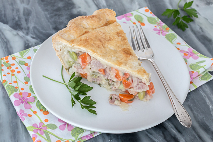 This Ham Pot Pie wraps up flavorful, smoky ham and plenty of vegetables in a flaky, buttery pastry to deliver comfort food at its best. 